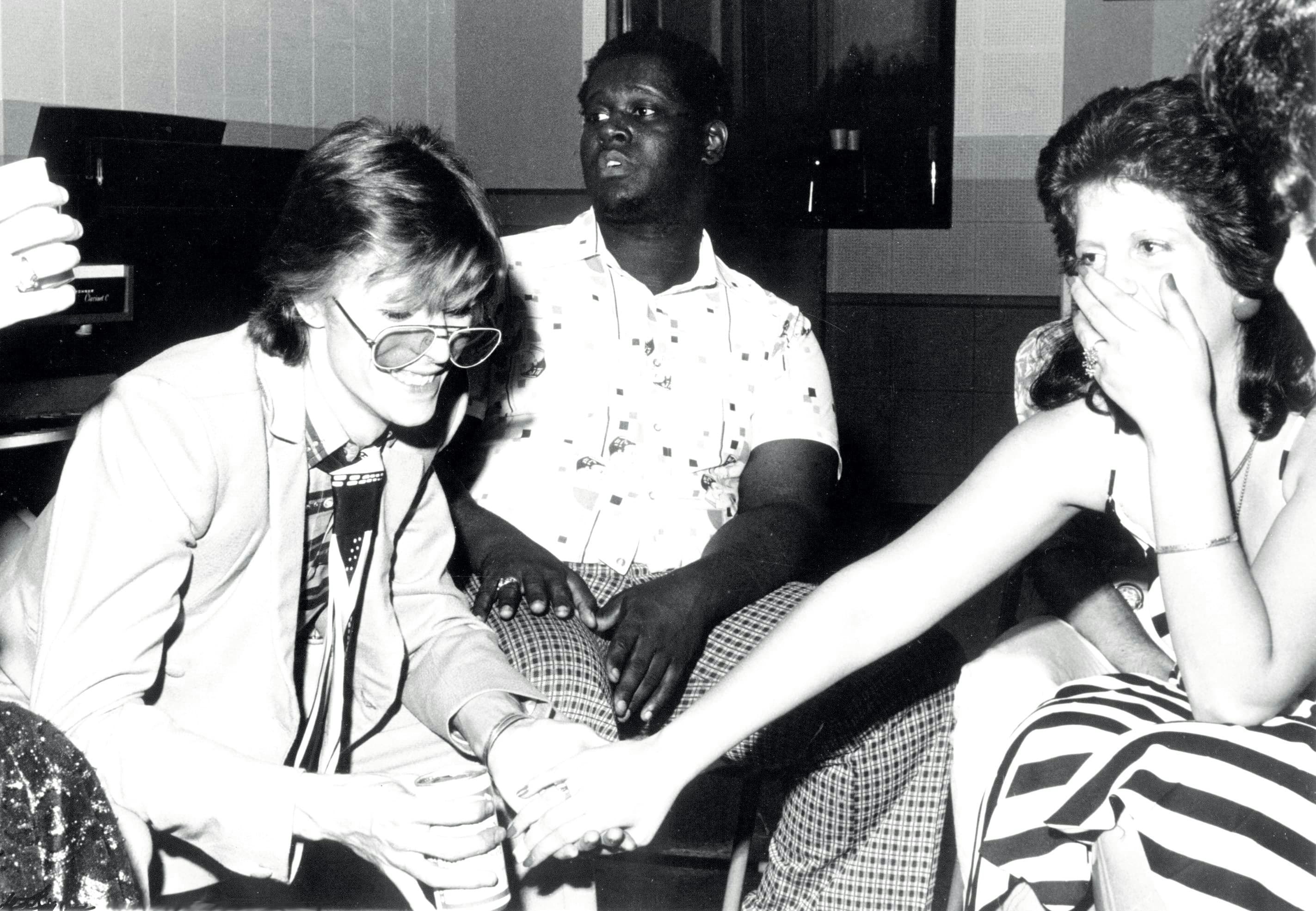 Bowie at Sigma Sound holding hands with fan, Sigma Kid Marla Kanevsky. Luther Vandross sits between them. Photo by Dagmar.